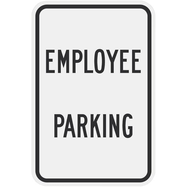 A white rectangular sign with black text that reads "Employee Parking" and has a black border.