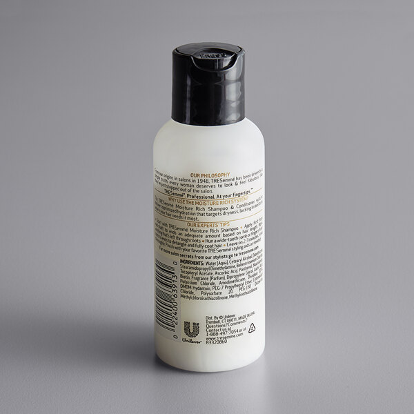 A case of TRESemme Luxurious Moisture Conditioner bottles with white labels and black lids.