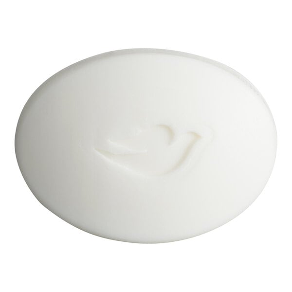 A white, oval-shaped bar of soap with a subtle bird-shaped imprint on its surface.
