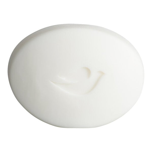 A white, oval-shaped bar of soap with a bird-shaped imprint on its surface.
