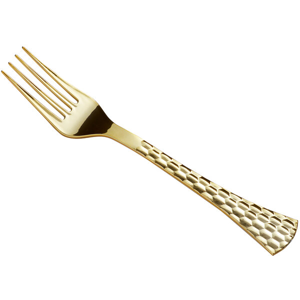 A close up of a Visions Brixton gold plastic fork with a gold handle.