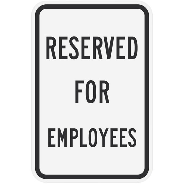 A white sign with black text reading "Reserved for Employees" above the Lavex logo.