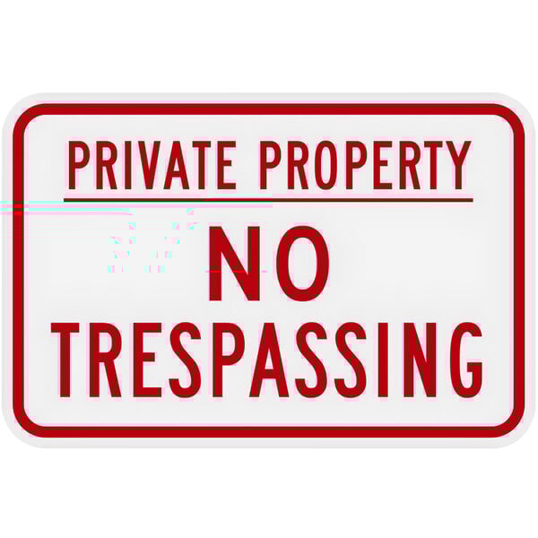 A white rectangular aluminum sign with red text that says "Private Property / No Trespassing"