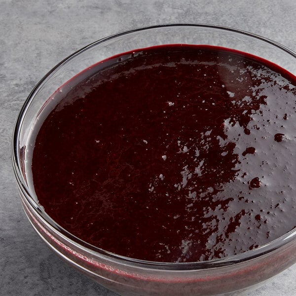 A bowl of Les Vergers Boiron blueberry puree on a counter.