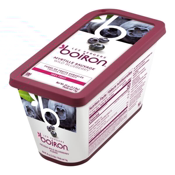 A container of Les Vergers Boiron Wild Blueberry fruit puree next to a container of blueberry yogurt.