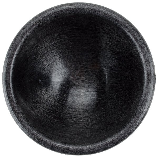 A black polypropylene Molcajete bowl.