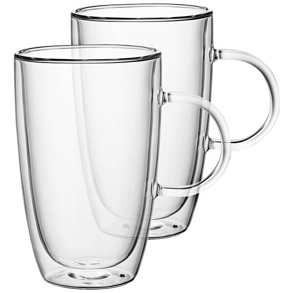 Two clear Villeroy & Boch glass cups with handles.