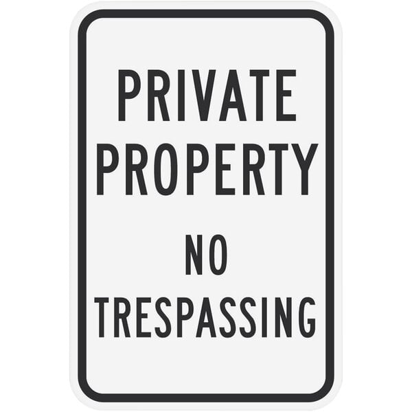 A white reflective aluminum sign with black text that says "Private Property / No Trespassing" and has a diamond grade pattern.