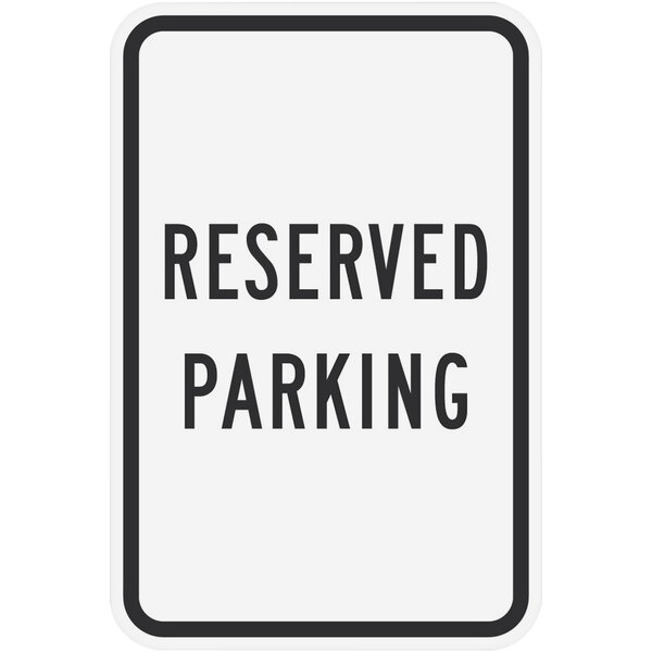 A white rectangular Lavex "Reserved Parking" sign with black text.
