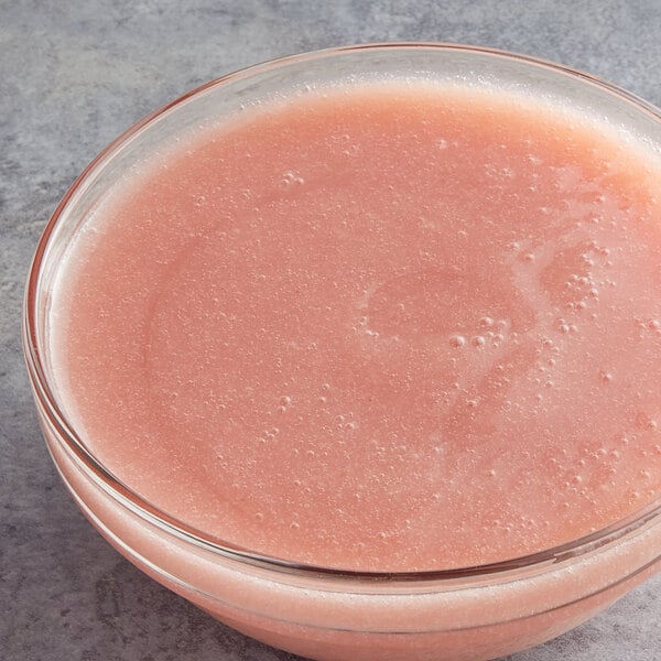 A glass bowl of Les Vergers Boiron white peach fruit puree.