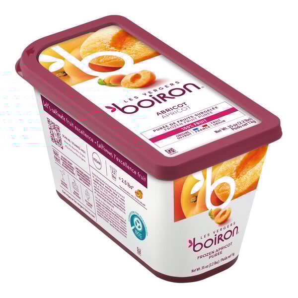 A container of yogurt with Les Vergers Boiron Apricot 100% Fruit Puree on a spoon.