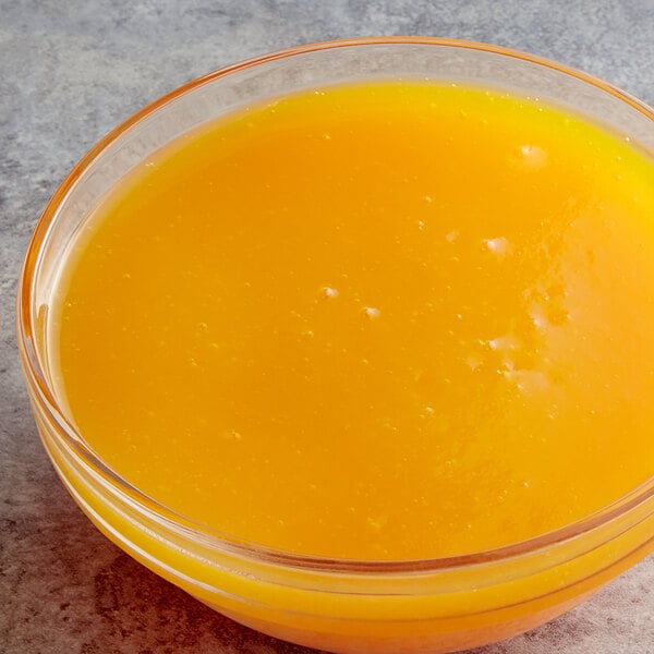 A bowl of Les Vergers Boiron Papaya Puree on a counter.