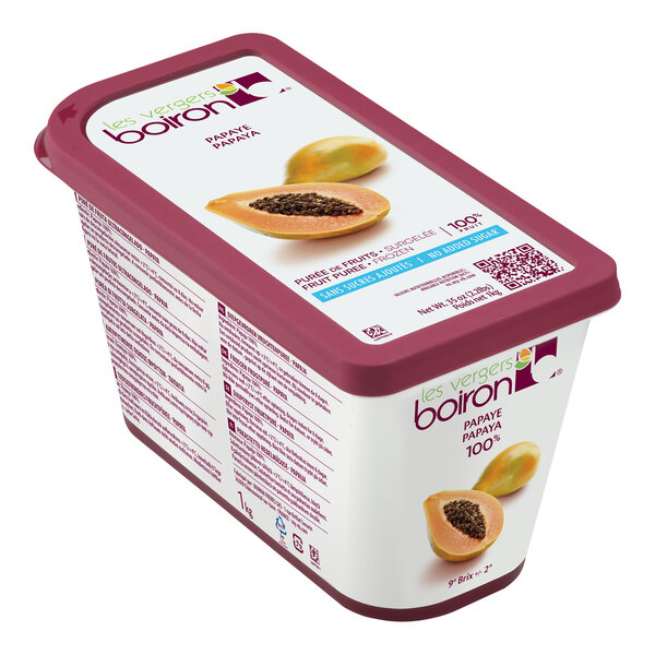 A container of yogurt with Les Vergers Boiron Papaya 100% Fruit Puree and berries.