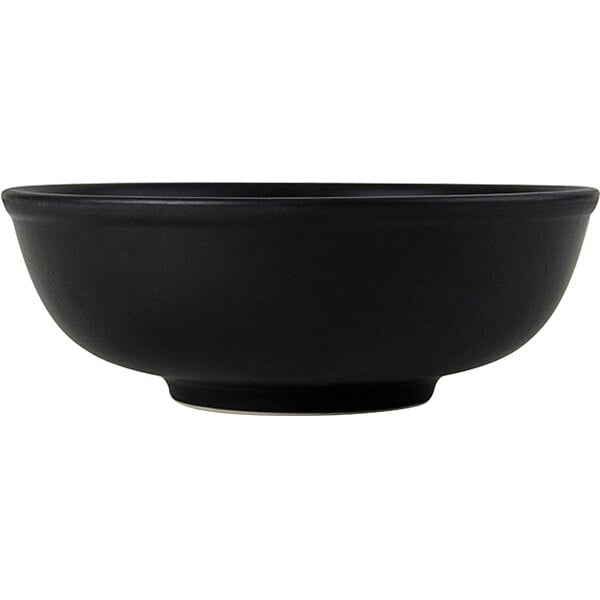 A black Tuxton China menudo bowl.