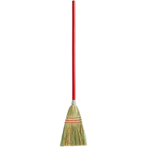 A close-up of a Carlisle 3-stitch lobby corn broom with a red and white handle.