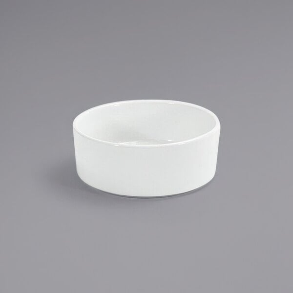 A Front of the House Soho bright white porcelain bowl on a gray surface.