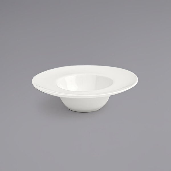 A white Front of the House Catalyst Monaco porcelain saucer with a hole in the middle.