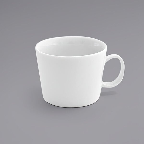 A close up of the handle of a white Front of the House Soho porcelain cup.