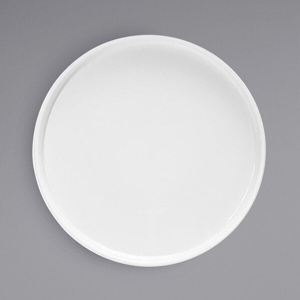 A Front of the House bright white porcelain plate with a raised rim on a white background.