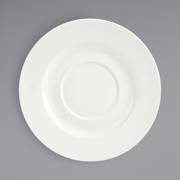 A white porcelain saucer with a small rim.