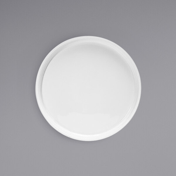 A Front of the House Soho bright white porcelain plate with a raised rim on a white background.