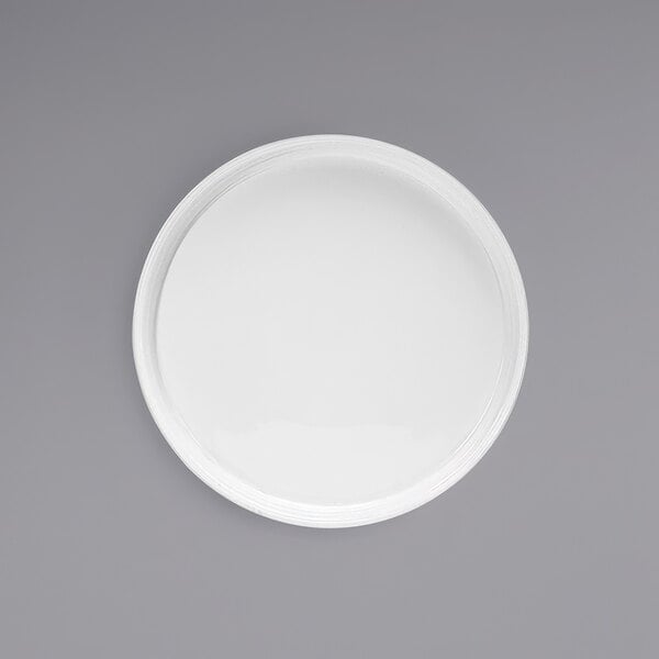A Front of the House bright white porcelain plate with a raised rim.