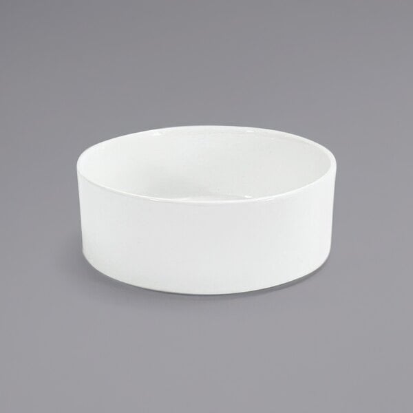 A Front of the House Soho bright white porcelain bowl on a gray background.