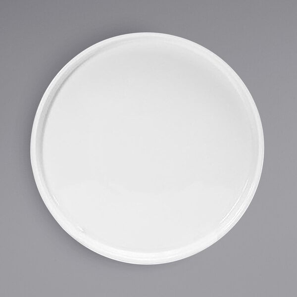 A Front of the House Soho bright white porcelain plate with a raised rim on a white background.