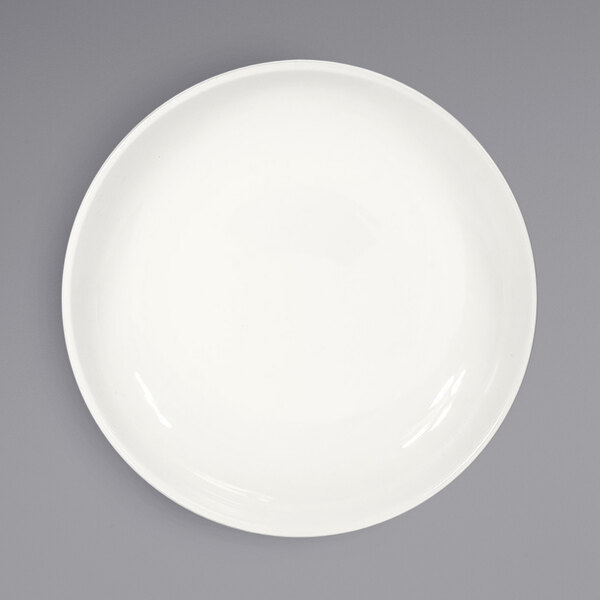 A white porcelain bowl with a white rim on a gray surface.