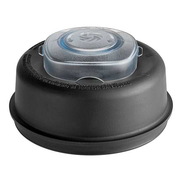 A black plastic lid with a clear plastic lid on top for a Vitamix container.
