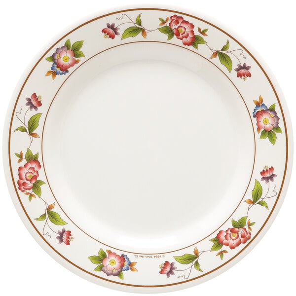 a white plate with flowers on it