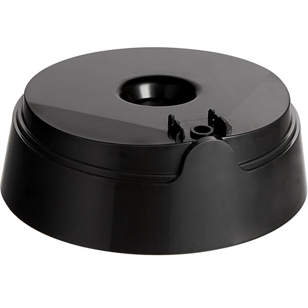 A black plastic lid with a hole for a Sunkist juicer.