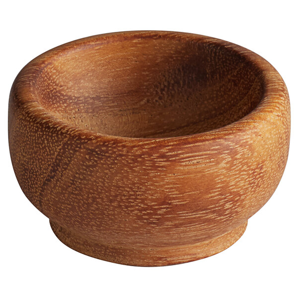 A Fox Run acacia wood condiment cup with a handle.