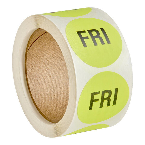 A roll of round yellow labels with the text 'FRI' printed in bold black letters.