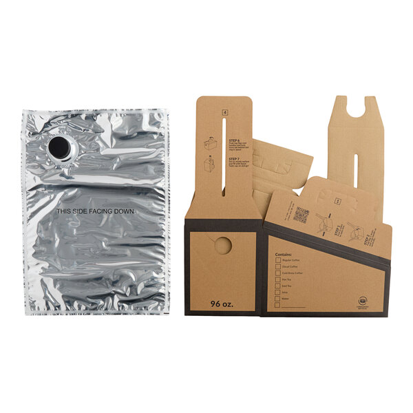 A silver foil beverage pouch and several flat, brown cardboard pieces with printed instructions, likely for assembly into a take-out container.