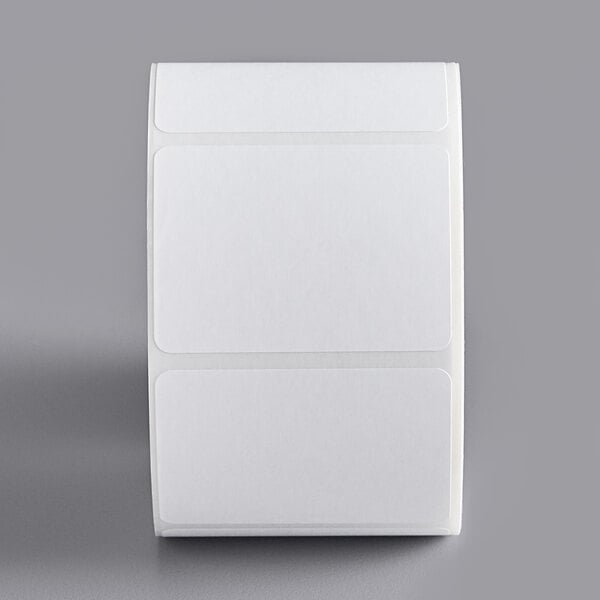 A roll of white rectangular stickers with a black border.