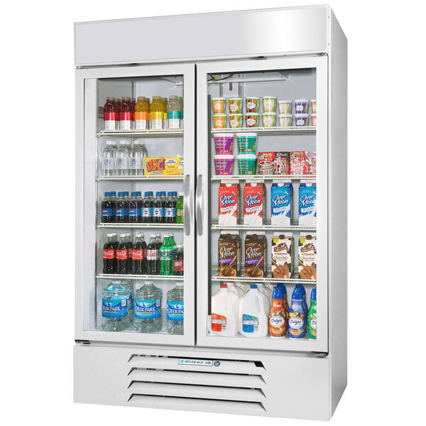 A white Beverage-Air glass door merchandiser filled with drinks.