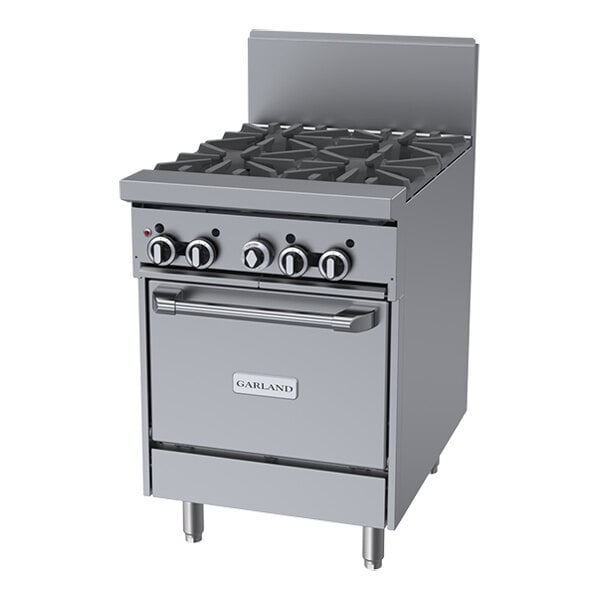 A stainless steel commercial gas range with four burners, control knobs, and an oven below.