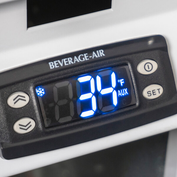A digital display on a Beverage-Air glass door merchandiser.