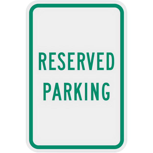 A white aluminum sign with green text that says "Reserved Parking" on a white background.
