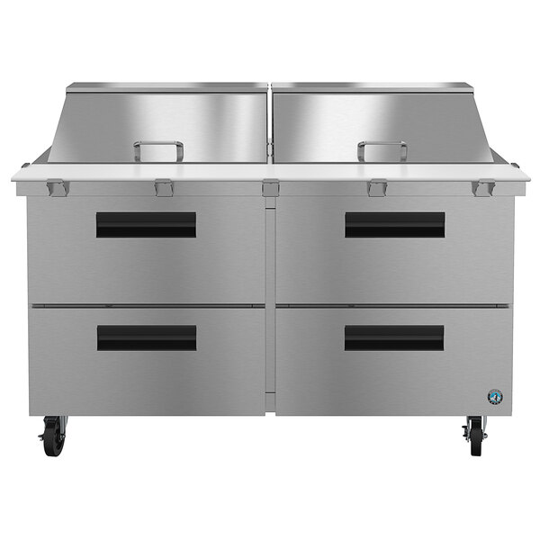 A Hoshizaki stainless steel refrigerated sandwich prep table with drawers.