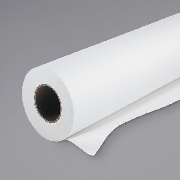 a roll of paper on a gray background