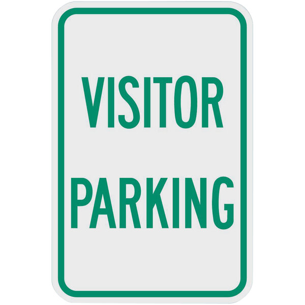 A white and green sign with green text that says "Visitor Parking"