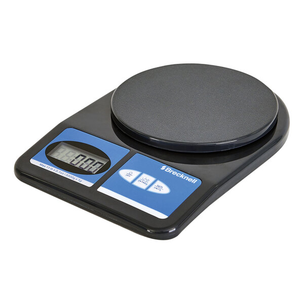 A black Brecknell digital scale with a round screen.
