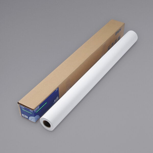 An Epson white paper roll next to a cardboard box.