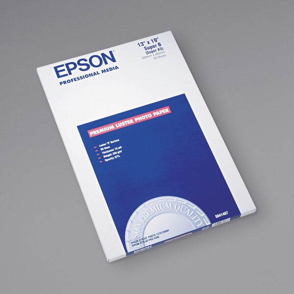 A pack of Epson Ultra Premium white photo paper with blue and white packaging.