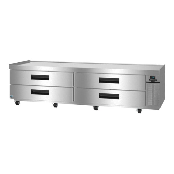 A large stainless steel refrigerated chef base with four drawers and a digital control panel.