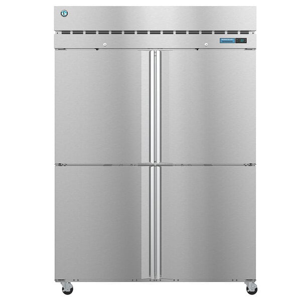 A large silver Hoshizaki reach-in refrigerator with two half solid stainless steel doors.