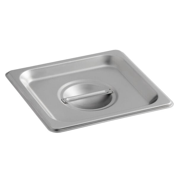 A Carlisle stainless steel pan cover on a stainless steel pan.