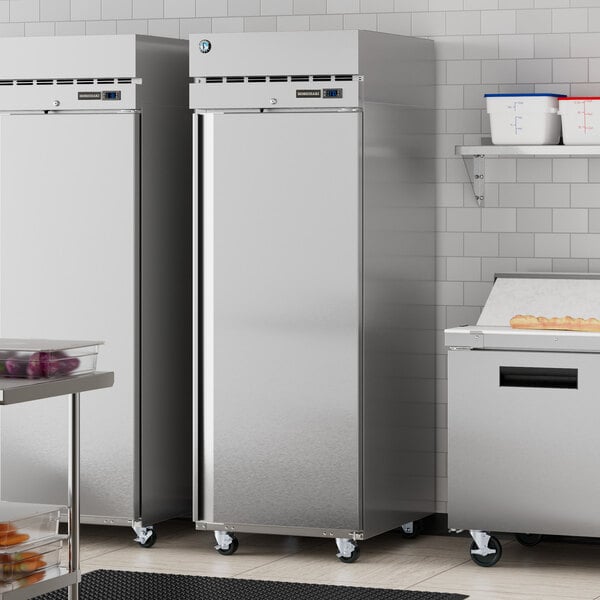 A stainless steel Hoshizaki reach-in refrigerator in a kitchen.